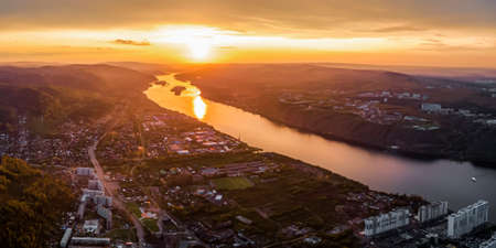 panorama of the evening city of Krasnoyarsk, the Yenisei river at sunset, suburbs. city buildings view from aboveの写真素材