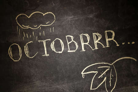 the chalk inscription OCTOBRRR, intentionally misspelling the word October, symbolizes the onset of cold weather in autumn, the arrival of rain and cloudy weather. brrrr...の写真素材