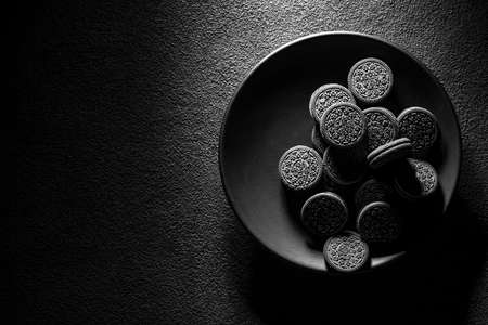 cookies in a black plate, art food photography, copy spaceの写真素材
