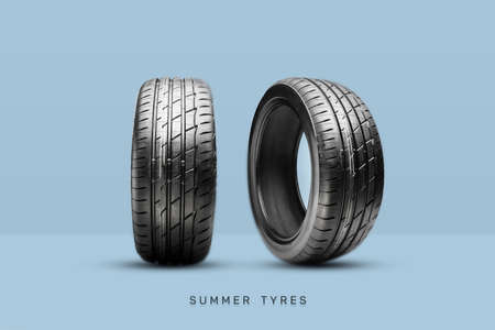 two new summer tires on a blue background. The inscription summer tyresの写真素材