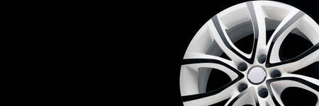 white car car alloy wheel, panoramic photo for the site header of the auto parts storeの写真素材