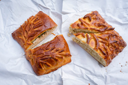 slices of fish and cabbage pie with a beautiful crust. pfdnhfr yf ghbhjlt pfdthyen with you on the roadの写真素材