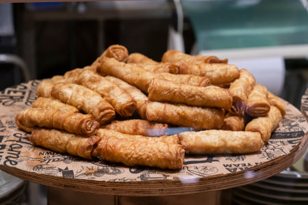 Turkish fried feta rolls on a tray in a Turkish bakery. delicious national pastries Turkish cuisineの写真素材