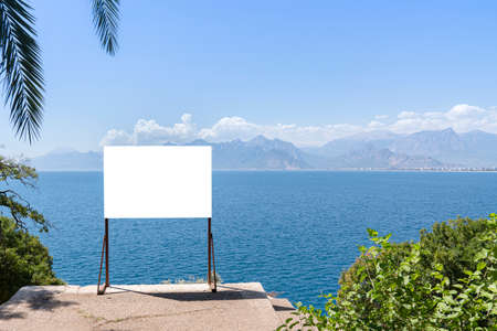 banner on the seashore. an empty mockup is an object for announcements about vacations, sea trips or sea cruisesの写真素材