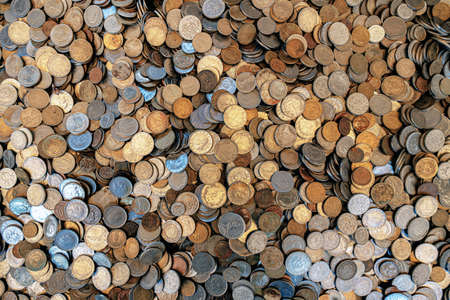 The background is a lot of old coins, Turkish lira, euro and rubles. treasure or treasure, investing...