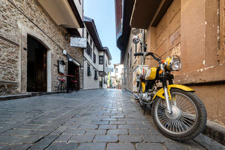 cozy streets of kaleichi in antalya motorcycle parked on an empty cozy street. peace and quiet in the historical center of Antalya in Turkey. travel and tourismの写真素材