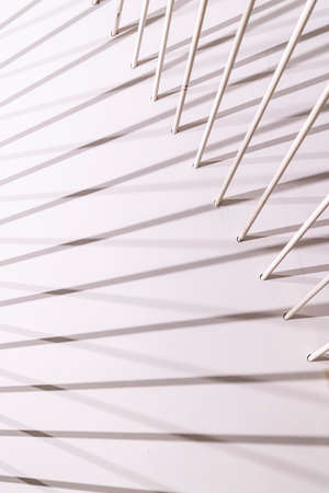 lines and shadows, art object detail, abstract background of pipes on a gray-white backgroundの写真素材