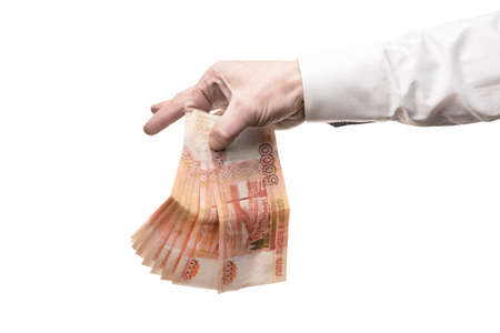 a mans hand holds Russian banknotes 5000 five thousand rubles isolate. monetary financial crisis in...