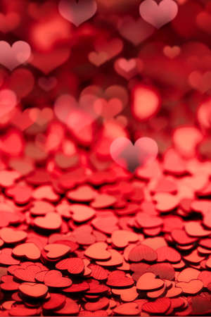 red shiny empty background of confetti hearts blur. it is suitable for creating a valentine card or...