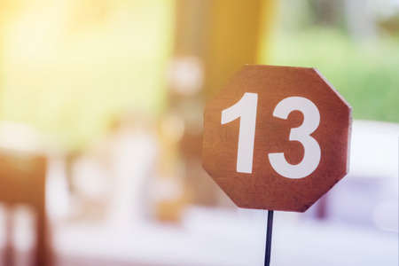 13 - thirteen, the number of the table in the restaurant. unlucky or lucky numberの写真素材
