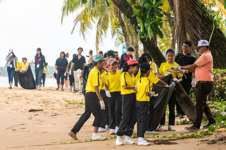 children and adults Asians, Thais, Chinese clean the beach and the seashore from garbage and waste. world cleaning and ecology Dayのeditorial素材