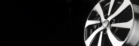 Tires and wheels of the copy space market with a black background. black and white stylish aluminum die-cast discの写真素材