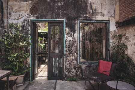 Old door and window, entrance. Thailand, Phangnga, Takua Pa The interior of the coffee shop in the...