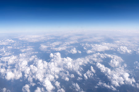Background of white clouds against a blue sky