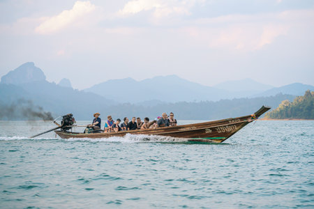 Cruise the calm waters of Thailand on a long-tail boat, exploring the beauty of lakes and mountains...