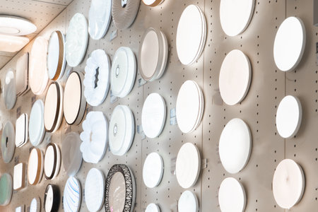 Shop features a diverse collection of modern ceiling lamps and wall sconces, showcasing various...