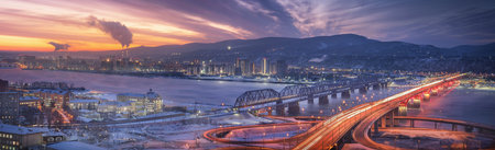 Evening panorama of Krasnoyarsk. Nikolaevsky 4th bridge and railway bridge over the Yenisei River at dawn. A breathtaking sunset paints vibrant colors over an urban river and picturesque cityscapeの写真素材