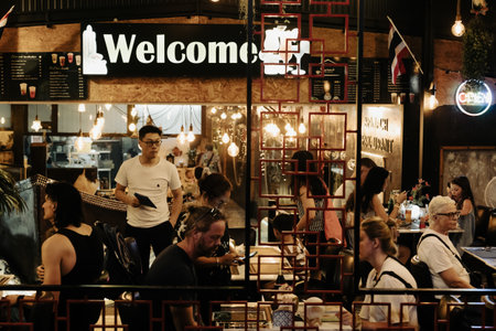 Khao Lak, Thailand, 16 11 2025: Welcome - an inscription on a nightclub with vacationing visitors, nightlife, entertainment and bars with drinks and food. High quality photo.のeditorial素材