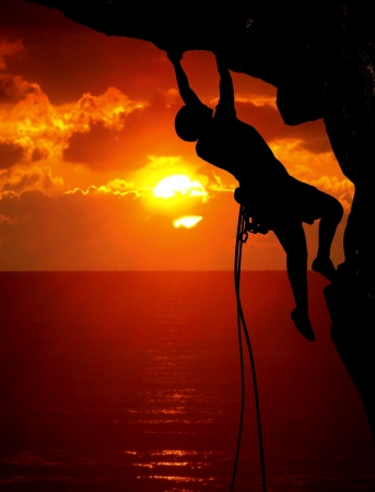 rock climbing during sunsetの写真素材
