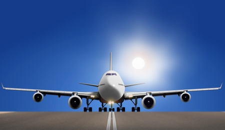 Air plane on runway with bright sun and blue skyの写真素材