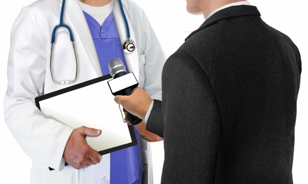 Reporter Interviewing Doctorの写真素材