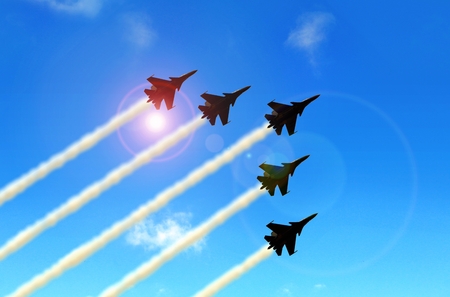 Military aerobatic jets formation under blue sky during Air Showの写真素材