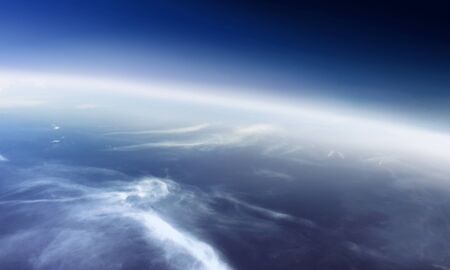 Blue cloudy sky from airplane window viewの写真素材