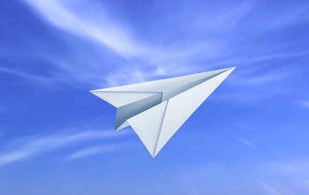 Paper plane and cloudy blue skyの写真素材