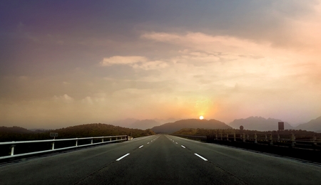 Empty open road during sunset