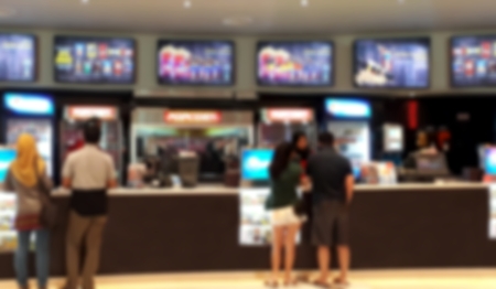 People buying snack at cinema food counterの写真素材