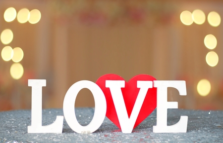 Love letters sign with blur lights in backgroundの写真素材