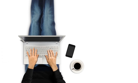Women typing with laptop from top view