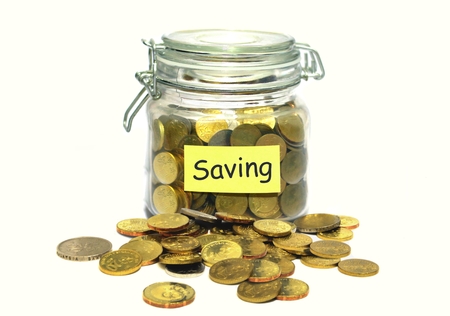 Coins in a glass jar saving conceptの写真素材