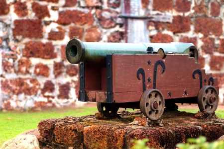 Old cannon in front of fortress wallの写真素材