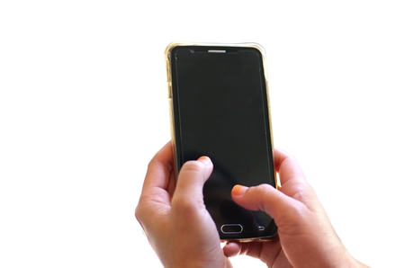 Hand holding smart phone over whiteの写真素材