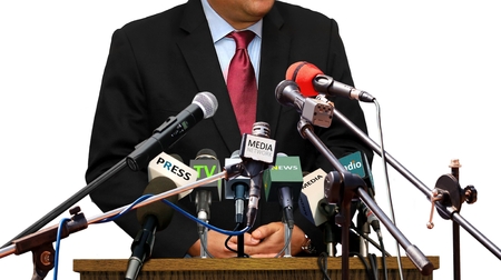 spokesman answering question during press conferanceの写真素材