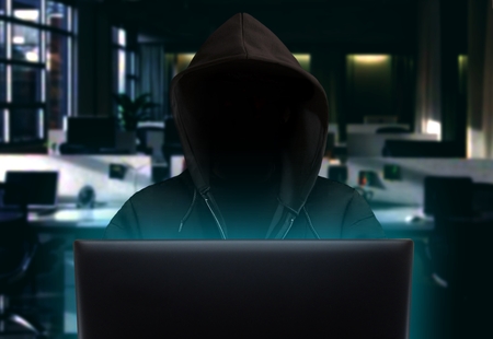 Hacker stealing data at nightの写真素材