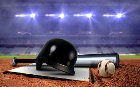 Baseball equipment in a stadium under spotlightsの写真素材