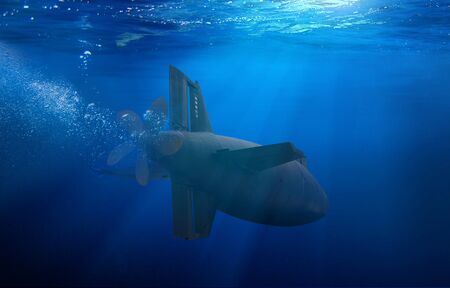 Naval submarine on a mission travelling under waterの写真素材