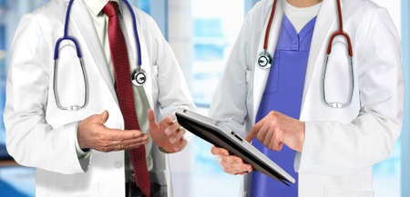 Specialist doctors having discussion regarding patient conditionの写真素材