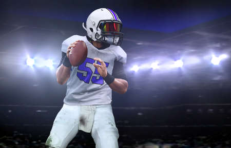 Quarterback  getting ready to throw a ball during a game at nightの写真素材