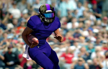 Quarterback running with spectator in backgroundの写真素材