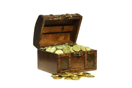 Treasure chest with gold coins over white backgroundの写真素材