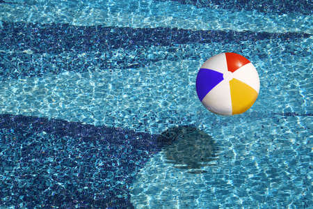 beach ball in the blue swimming poolの写真素材