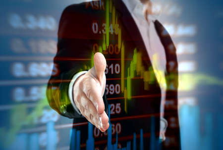 Businessman open hand with stock market transaction data and chart in backgroundの写真素材
