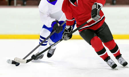 ice hockey players in the competitive match in the rinkの写真素材