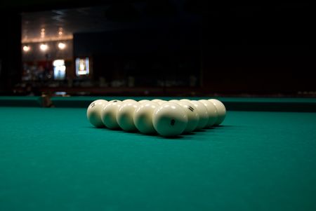 Pyramid of billiards balls on green tableの写真素材
