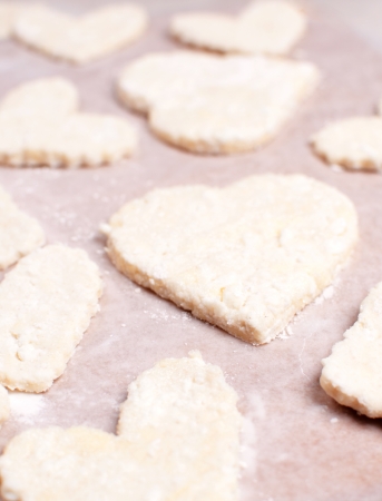 Heart shaped cookie from dough before bakingの写真素材