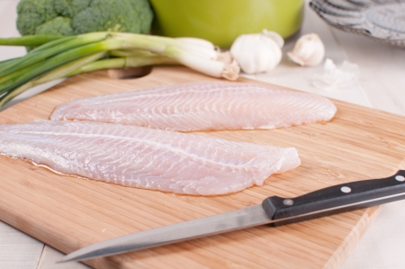 Defrosted fish fillets with vegetables horizontalの写真素材