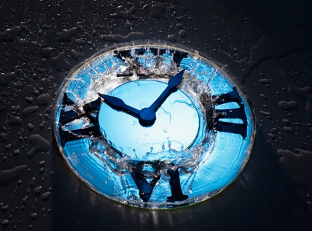 Unusual hours with water on black backgroundの写真素材